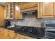 Kitchen featuring granite countertops and stainless steel gas cooktop at 517 Belmont Cir, Wake Forest, NC 27587