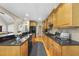 Kitchen with stainless steel appliances, hardwood floors, and a breakfast bar at 517 Belmont Cir, Wake Forest, NC 27587