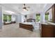 Spacious primary bedroom suite featuring a tray ceiling, generous natural light, and wood furniture at 517 Belmont Cir, Wake Forest, NC 27587