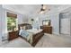 Comfortable main bedroom suite featuring a tray ceiling, carpet, and ample natural light at 517 Belmont Cir, Wake Forest, NC 27587