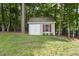 Exterior shot of shed surrounded by greenery on a sunny day at 517 Belmont Cir, Wake Forest, NC 27587