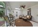 Cozy sunroom with wicker furniture, a ceiling fan, and views of the outdoor space at 517 Belmont Cir, Wake Forest, NC 27587