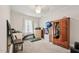 Bright bedroom with carpeted floors; includes wardrobe, chairs, and artwork at 520 Park Ave, Rocky Mount, NC 27801