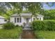 Charming single-story home with a cozy front porch, well-maintained lawn, and mature landscaping at 520 Park Ave, Rocky Mount, NC 27801