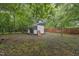 Backyard shed surrounded by mature trees at 520 Park Ave, Rocky Mount, NC 27801