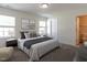 Bedroom features neutral color palette, two windows for natural light and ensuite bath at 5225 Big Bass Dr, Raleigh, NC 27610