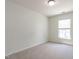 An empty bedroom featuring neutral carpet and a window at 5225 Big Bass Dr, Raleigh, NC 27610