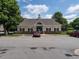 Exterior shot of the clubhouse with parking spaces at 5225 Big Bass Dr, Raleigh, NC 27610
