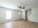 Bright living room featuring wood-look flooring, a window, and closet storage at 5225 Big Bass Dr, Raleigh, NC 27610