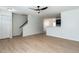 Open-concept living area featuring wood-look flooring and stairs leading upstairs at 5225 Big Bass Dr, Raleigh, NC 27610