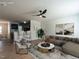 Staged living room featuring stylish decor and seamless flow into the kitchen at 5225 Big Bass Dr, Raleigh, NC 27610