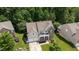 Beautiful two-story home with stone accents, two-car garage, and lush green lawn at 534 Siltstone Pl, Cary, NC 27519