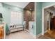 Modern bathroom boasts tiled shower, bench seating, wood cabinets, and neutral color palette at 534 Siltstone Pl, Cary, NC 27519