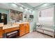 Bathroom with separate vanity, bench seat, soaking tub and tiled shower at 534 Siltstone Pl, Cary, NC 27519
