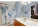 Bathroom featuring a sink vanity, toilet, unique shower curtain, and tile floors at 534 Siltstone Pl, Cary, NC 27519