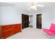 Bedroom featuring a dresser, carpet floors, and access to closet space at 534 Siltstone Pl, Cary, NC 27519
