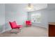 Spacious bedroom featuring bright red chairs, carpet floors, and a ceiling fan at 534 Siltstone Pl, Cary, NC 27519