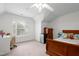Bright bedroom features carpet floors, ceiling fan, and ample natural light at 534 Siltstone Pl, Cary, NC 27519