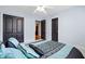 Comfortable bedroom featuring carpet floors, ceiling fan, and closet space at 534 Siltstone Pl, Cary, NC 27519