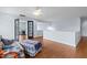 Lofted bonus room features hardwood floors, fan, and views to office and hallway at 534 Siltstone Pl, Cary, NC 27519