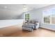 Bright bonus room with hardwood floors, ceiling fan, and natural light at 534 Siltstone Pl, Cary, NC 27519