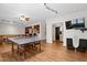 Large game room featuring a ping pong table, TV and seating area at 534 Siltstone Pl, Cary, NC 27519