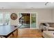 Spacious game room with ping pong table and sliding doors to a covered outdoor area at 534 Siltstone Pl, Cary, NC 27519