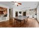 Open game room with a kitchenette, ping pong table and stairs leading to another area at 534 Siltstone Pl, Cary, NC 27519