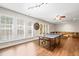 Open game room with a ping pong table and large windows at 534 Siltstone Pl, Cary, NC 27519