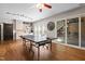 Spacious game room featuring a ping pong table, kitchenette and sliding doors to an outdoor area at 534 Siltstone Pl, Cary, NC 27519