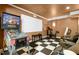 Game room featuring a pinball machine, workout equipment and theater seating at 534 Siltstone Pl, Cary, NC 27519