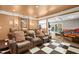 Home theater with reclining seats, projector, screen and a pinball machine at 534 Siltstone Pl, Cary, NC 27519