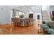 Open-concept kitchen boasts a large island with seating, stainless steel appliances, and modern white cabinets at 534 Siltstone Pl, Cary, NC 27519
