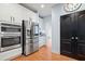 Well-equipped kitchen with stainless steel appliances, white cabinets, and a modern design at 534 Siltstone Pl, Cary, NC 27519