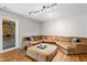Comfortable living room area with large sectional sofa and access to outside at 534 Siltstone Pl, Cary, NC 27519