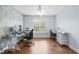 Office with hardwood floors, desk, and rolling storage unit at 534 Siltstone Pl, Cary, NC 27519