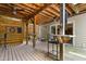 Well-designed outdoor bar area with seating, ceiling fans, and access to the backyard at 534 Siltstone Pl, Cary, NC 27519