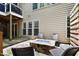 Cozy patio with a stone firepit and comfortable seating, ideal for outdoor gatherings and relaxation at 534 Siltstone Pl, Cary, NC 27519