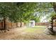 Expansive backyard with a storage shed and mature trees, ideal for outdoor activities at 6001 Winged Willet Ct, Wendell, NC 27591