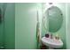 Charming powder room with a sink and decorative mirror at 6001 Winged Willet Ct, Wendell, NC 27591
