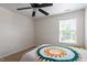 Simple bedroom featuring a colorful bedspread and ample natural light at 6001 Winged Willet Ct, Wendell, NC 27591