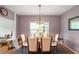 Stylish dining room with a modern chandelier, comfortable seating, and a serene ambiance at 6001 Winged Willet Ct, Wendell, NC 27591