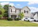 Attractive two-story home features a well-kept lawn, a cozy front porch, and a convenient two-car garage at 6001 Winged Willet Ct, Wendell, NC 27591