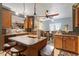 Inviting kitchen with an island, breakfast bar, and wood cabinets at 6001 Winged Willet Ct, Wendell, NC 27591