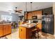 Spacious kitchen with wood cabinets, a center island, and modern appliances, ideal for cooking and entertaining at 6001 Winged Willet Ct, Wendell, NC 27591