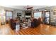 Cozy living room with a fireplace, decorative art, and comfortable seating, perfect for entertaining at 6001 Winged Willet Ct, Wendell, NC 27591
