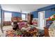 Spacious main bedroom showcasing a colorful rug, king bed, and sitting area at 6001 Winged Willet Ct, Wendell, NC 27591