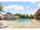 Large community pool with lounge chairs, perfect for relaxing and enjoying the sunny outdoors at 6001 Winged Willet Ct, Wendell, NC 27591