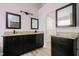 Elegant bathroom featuring double vanities with granite countertops and dark wood cabinetry at 616 Cheselden Dr, Durham, NC 27713