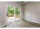 Bedroom with sliding glass door access to an outdoor deck, creating a seamless indoor-outdoor flow at 616 Cheselden Dr, Durham, NC 27713